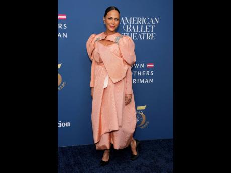 Nicole Ari Parker is on point, pairing her peach satin dress with Christian Louboutin’s Cassia Nodo pump in black crepe satin, a stiletto-inspired pointe shoe.