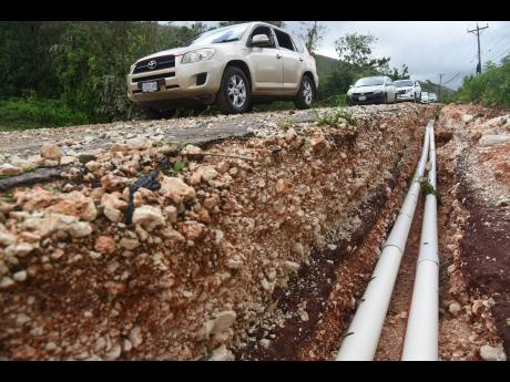 Damage to the Spur Tree main road in Manchester arising from Hurricane Melissa.
