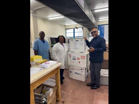 Consultant Haematologist-Oncologist at Health Services Authority in the Cayman Islands, Dr Lundie Richards, with staff at the National Blood Transfusion Service (Blood Bank) in Jamaica. The country donated a supply of blood and plasma to Jamaica following 