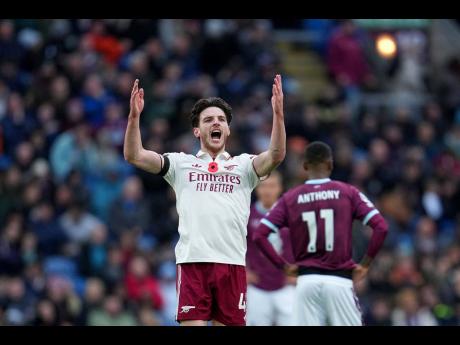 Arsenal’s Declan Rice celebrates after scoring his side’s second goal during the English Premier League soccer match against Burnley in Burnley, England, yesterday. Arsenal won 2-0.