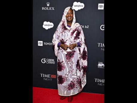 Poet, activist and UNHCR Goodwill Ambassador Emi Mahmoud is all smiles as she celebrates being named a TIME100 Next generation leader.