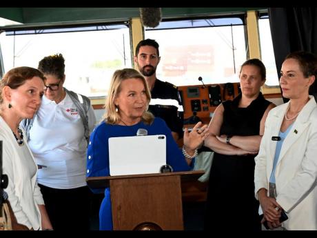 EU Ambassador Dr Erja Askola delivers remarks during Monday’s handing over of emergency supplies following Hurricane Melissa. Foreign Affairs Minister Kamina Johnson Smith (right) and European partners look on.