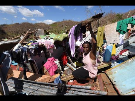 Credit: Ian Allen/Photographer Sixty-year-old Juliet Clarke, from Ipswich, St Elizabeth, shows where she got trapped under the rubble of her three-bedroom board house after it collapsed on top of her during the passage of Hurricane Melissa last week Tuesday.