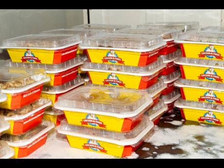 Hot and ready meals are packaged at Chicken & Tings and airlifted to affected areas in western Jamaica.