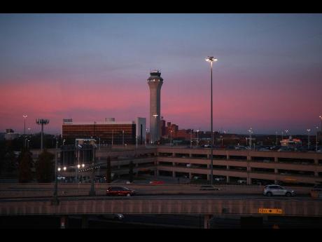 A control tower operates at Newark Liberty International Airport on Friday, November 7, 2025, in Newark, N.J. (AP Photo/Andres Kudacki)