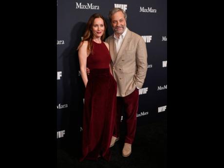 Writer and director Judd Apatow (right) and his wife, actress Leslie Mann, pose together at the 2025 Women in Film Honors on Thursday, where daughter Maude Apatow received the Max Mara Face of the Future Award.
