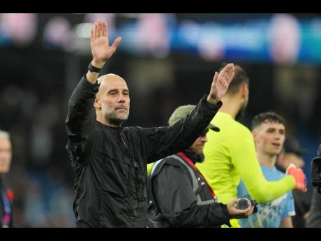 Manchester City’s head coach Pep Guardiola leaves the field at the end of the English Premier League  match between Manchester City and Liverpool in Manchester, England, yesterday.