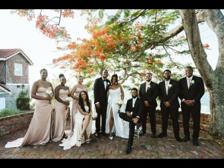 Credit: Jroyal Productions The newly-weds pose happily with their supportive wedding party.