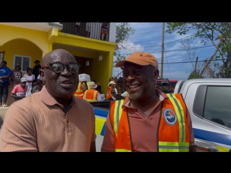 Credit: Photo by Adrian Frater Lucea’s Mayor Sheridan Samuels (left) expressing his gratitude to Portmore’s Mayor Leon Thomas for the supplies he brought the people of Hanover.