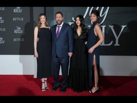  Adam Sandler (second left) and family (from left), wife Jackie Sandler and daughters Sadie Sandler and Sunny Sandler. 