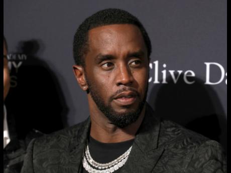 Sean Combs arrives at the Pre-Grammy Gala And Salute To Industry Icons at the Beverly Hilton Hotel, January 25, 2020, in Beverly Hills, California. (Photo by Mark Von Holden/Invision/AP, File)
