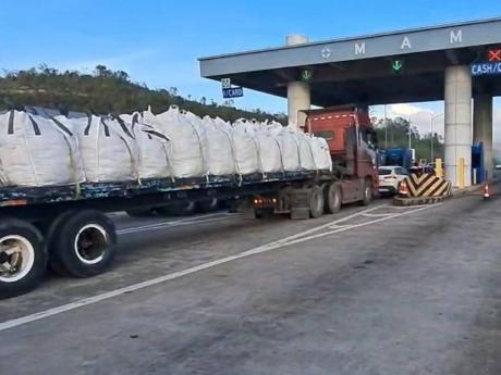 An ODPEM convoy at toll booth at Mammee Bay, St Ann, delivering relief supplies to storm‑hit parishes.