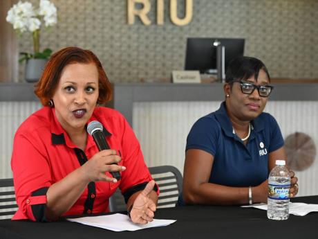Credit: Ashley Anguin/Photographer Niurka Garcia-Linton (left), director of sales at RIU Resorts Jamaica, addresses the media during a press briefing at RIU Montego Bay as Somae Pitkin-Shakes, human resource manager, RIU Montego Bay, looks on.