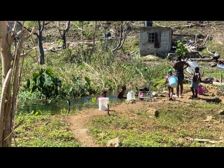 Whithorn residents seen swimming and catching water upstream, close to a pool of stagnant water.