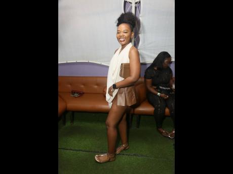 Credit: Nathaniel Stewart Tae Morgan steps out in a slouch halter top and a sleek mini skirt.
