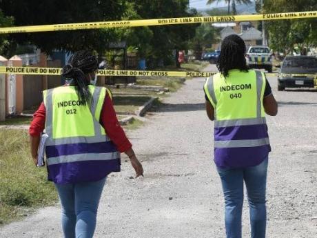 INDECOM investigators at a scene. - File photo.
