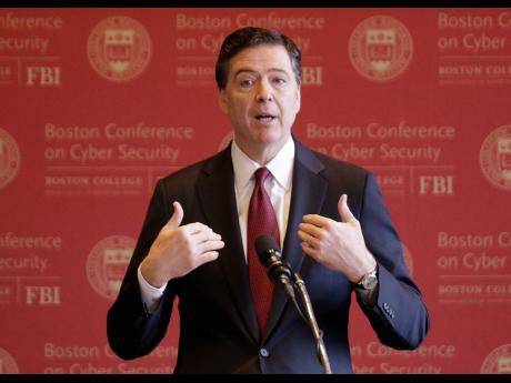 FBI Director James Comey gestures as he speaks on cyber security at the first Boston Conference of Cyber Security at Boston College, March 8, 2017, in Boston. (AP Photo/Stephan Savoia, File)