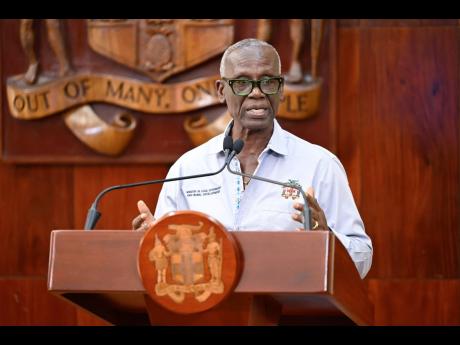 Credit: JIS News Minister of Local Government and Community Development, Desmond McKenzie, addressing a special press briefing on Hurricane Melissa recovery at Jamaica House on November 26.