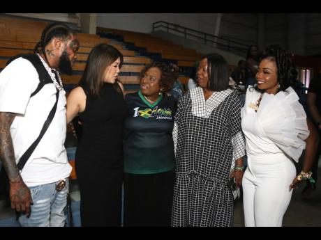 Minister Olivia Grange (centre) is flanked by a few of the artistes who were present at the I Love Jamaica telethon and virtual concert on Sunday. From left: Tommy Lee, Tessanne Chin, Chevelle Franklyn, and Pamputtae.