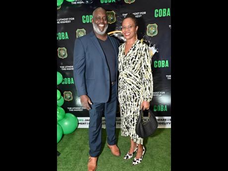 Julian Robinson, head coach of Calabar High School, and his wife, Tamara Robinson, make a stylish entrance at the Calabar Old Boys’ Association Cocktail and Awards Ceremony.