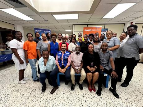 A team of healthcare workers from the Ministry of Health and Wellness and the South East Regional Health Authority at their psychological first aid training in Kingston on November 12.