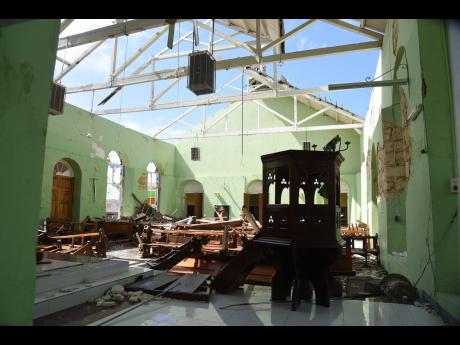 
The St Peter’s Anglican Church in Petersfield, Westmoreland, lies in ruins after Hurricane Melissa tore through the area.