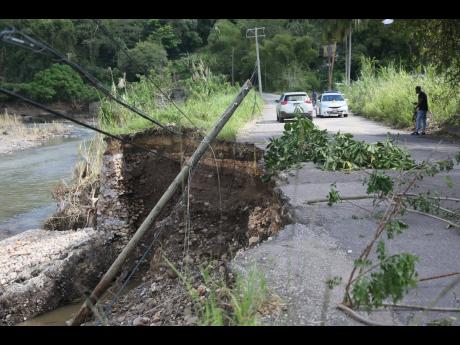 A light pole which was washed away during the passage of Hurricane Melissa sits on the side of a road in Pennants, Clarendon.
