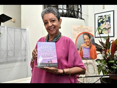 Credit: Rudolph Brown First-time author Sandra D. Cooper, at the launch of her debut book, ‘Flying Without Wings: How to Live as a Spiritual Superhero in a Human Bodysuit’, at the Temple of Light Centre for Spiritual Living on Wednesday.