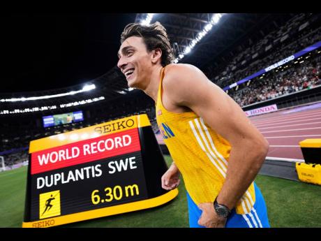 Sweden’s Armand Duplantis reacts after winning gold and setting a world record in the men’s pole vault final at the World Athletics Championships in Tokyo on September 15.