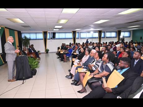 Minister of Justice and Constitutional Affairs, Delroy Chuck, addressing the commissioning ceremony for Justices of the Peace for Kingston, held on December 4, 2025, at Kingston Bookshop, downtown Kingston.