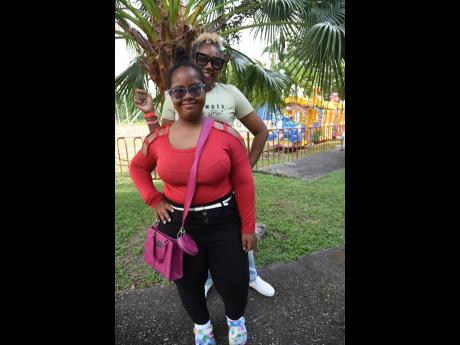Yvonne Smith Tracey (background) poses with her daughter Sekaai Tracey during the Digicel Foundation Christmas treat for special needs children.
