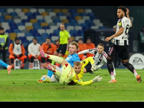  Napoli’s Rasmus Hojlund (centre)  scores the opening goal during the Serie A  match between Napoli and Juventus in Naples, Italy, yesterday.