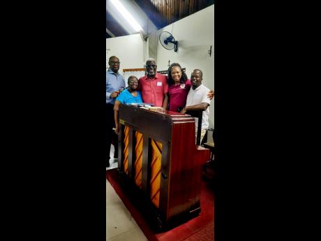 From left: Chaplain Reverend Karl Henlin, past member Grace England, guitarist Lewis Campbell, pianist Karen Henry and drummer Odean Taylor after the Portmore Chorale’s Christmas concert at the Church of the Holy Spirit.
