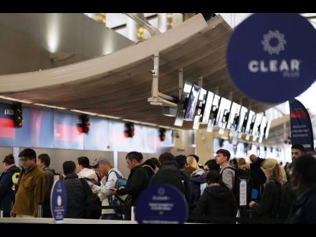 Credit: Ryan Sun Travellers wait in a TSA checkpoint at Detroit Metropolitan Wayne County Airport Wednesday, November 26, 2025, in Romulus, Mich. (AP Photo/Ryan Sun)