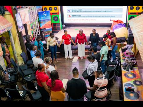 JMMB team members and parents at the recently organised CHAMP Parenting Conference in Montego Bay.