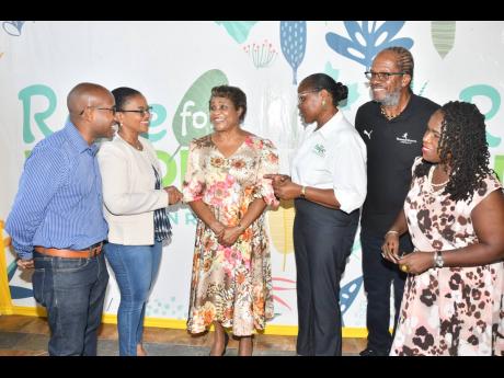 Lady Allen (third left) engages in conversation with Claudine Allen (second left), general manager, JN Foundation; Carla Myrie (third right), executive director of the Nature Preservation Foundation (NPF); Alfred ‘Frano’ Francis (second right), directo