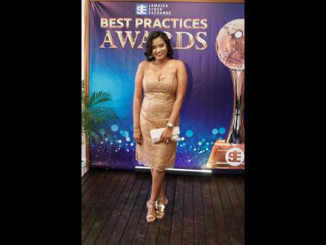 Okelia A. Parredon, vice president of sales and client services at Mayberry Investments, glows in gold.