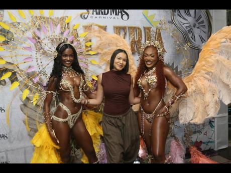 Yard Mas Creative Director Anna-Lisa Guthrie (centre) is flanked by models Rachel Silvera (left) and Tashnie Hinds.