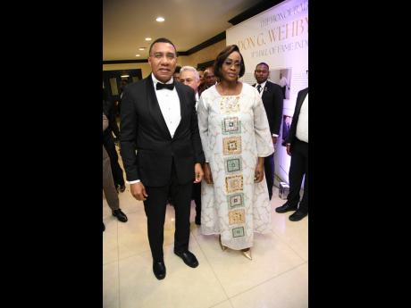 Prime Minister Andrew Holness and his wife, Speaker of the House of Representatives Juliet Holness, make their grand entrance.