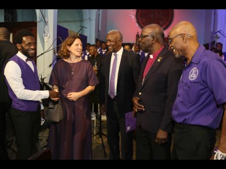 From left: Lloyd McEwan Jnr., chairman of the Choir Committee; French Ambassador to Jamaica Marianne Ziss; Michael Vaccianna; Reverend Leon Golding; and Professor Patrick Dallas at Kingston College Chapel Choir’s Tidings of Comfort and Joy Christmas conc