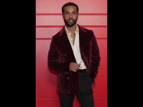  Lucien Laviscount in Dolce & Gabbana, a velvet jacket, paired with black trousers. 