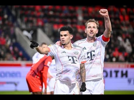 Bayern’s Luis Díaz (left) celebrates with Harry Kane after scoring their side’s third goal of the game during the Bundesliga match between FC Heidenheim and Bayern Munich in Heidenheim, Germany, yesterday.