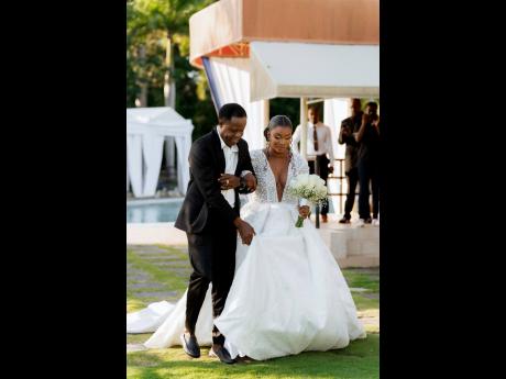 Credit: Design Dojo A vision of perfection, this stunning bride is happy to be escorted up the aisle by her father, Radcliffe Titus.