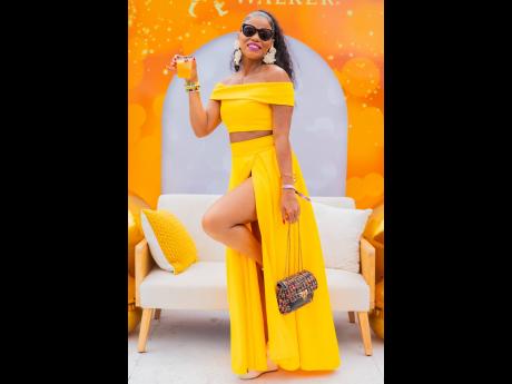 Left: Raising her drink to a jolly good time is financial adviser 
Sheryl 
Hines.