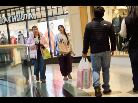  AP
Shoppers walk around the Somerset Collection mall on Wednesday, December 10, in Michigan, USA.