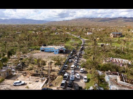 This aerial photo shows a traffic gridlock in Lacovia, St Elizabeth after Hurricane Melissa hit in October.