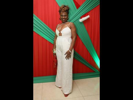 Tena Wilson-Davis, accountant, chose a white jumpsuit paired with red and gold accessories.