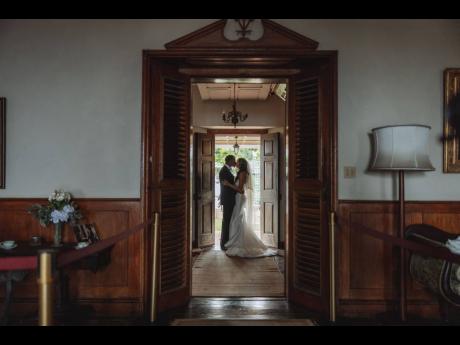 The Andersons share a kiss as husband and wife. 