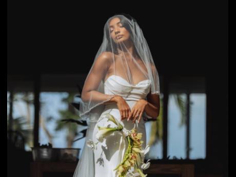 The beautiful bride, Jordanne wearing a fit-and-flare silk mikado gown by Allure Bridals.