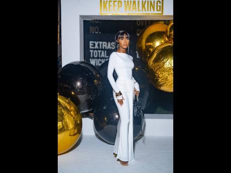 Actress Joan McKenzie is a vision in white.